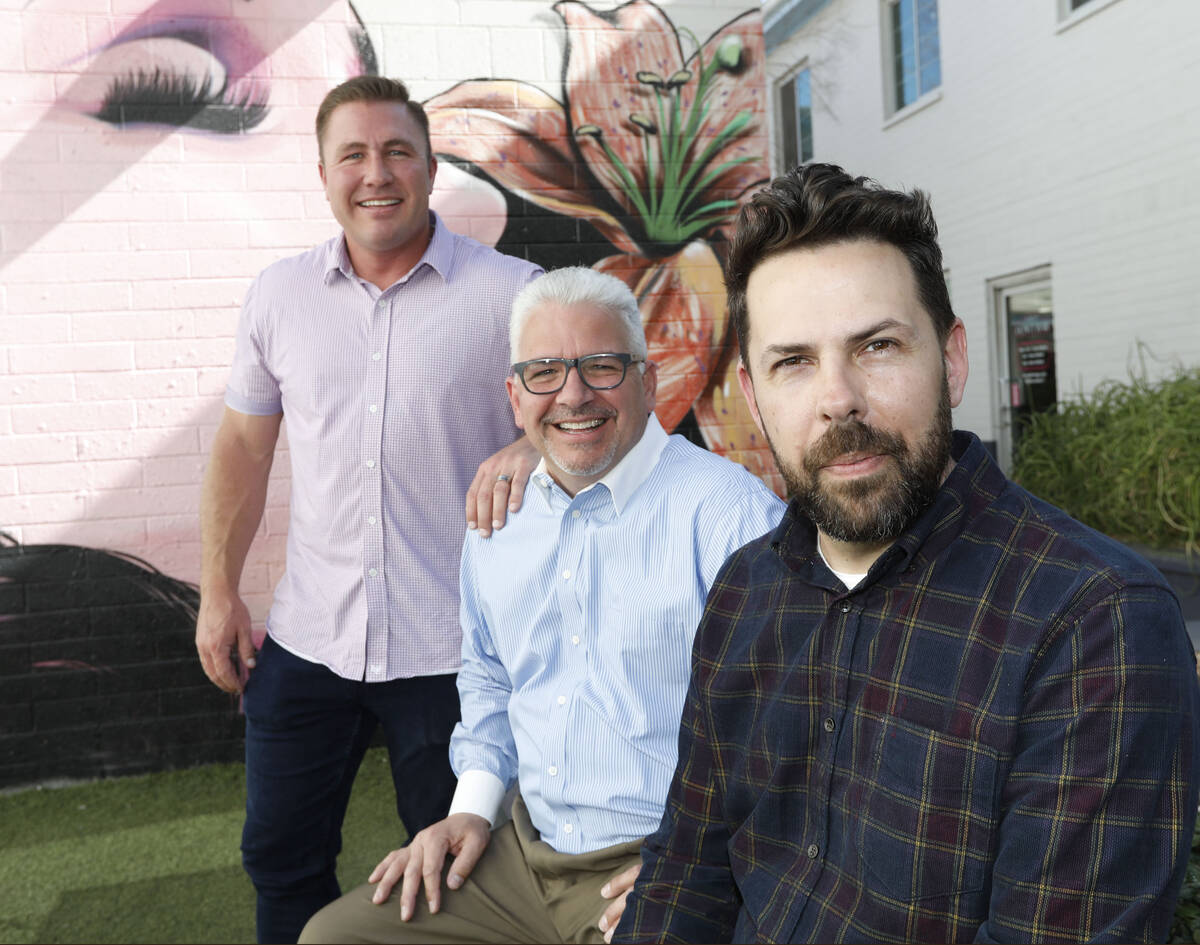 Dinette representatives, Trent Jones, from left, Nick A. Della Penna and Jerad Howard, pose for ...