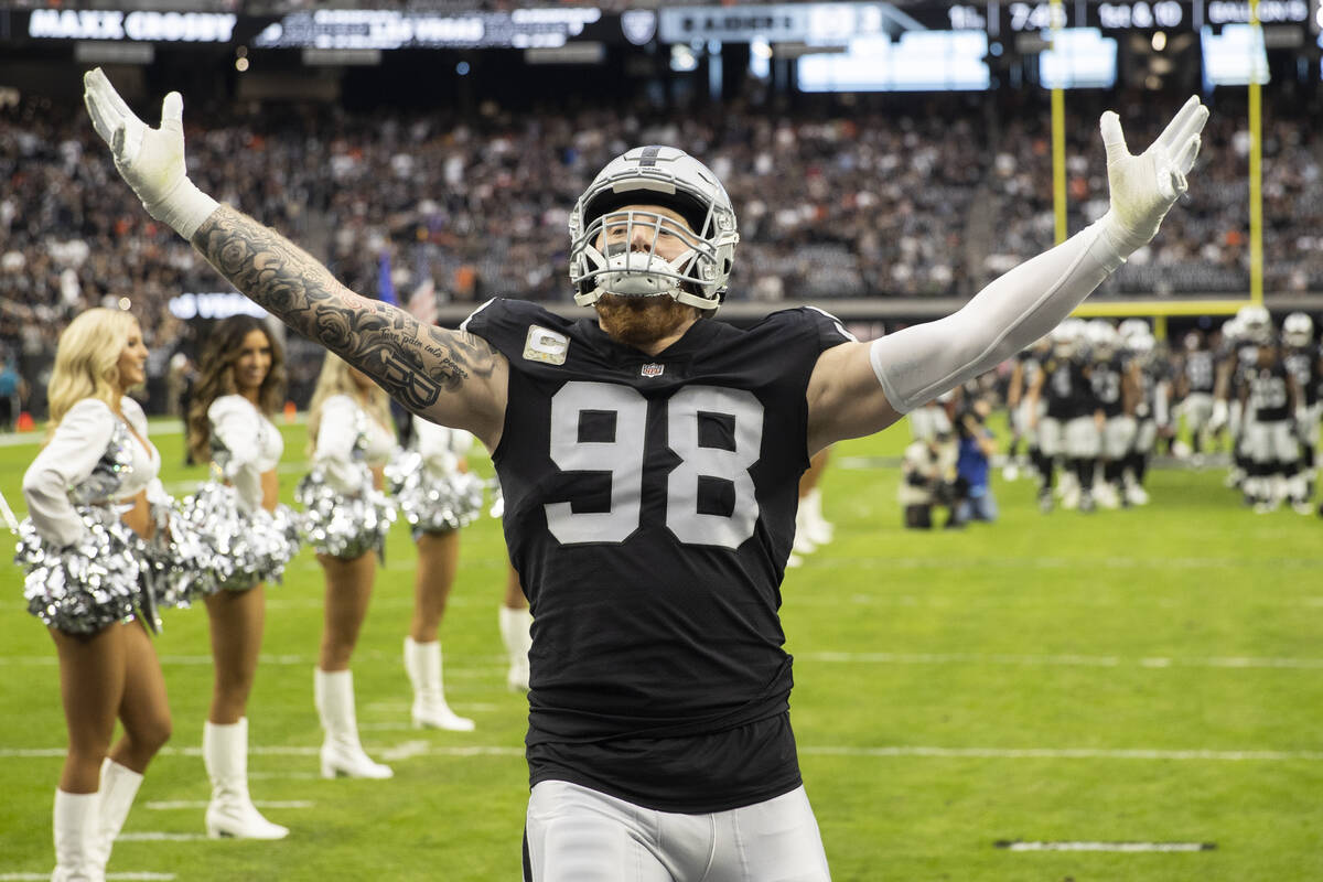 Raiders defensive end Maxx Crosby (98) is announced before the start of an NFL football game ag ...