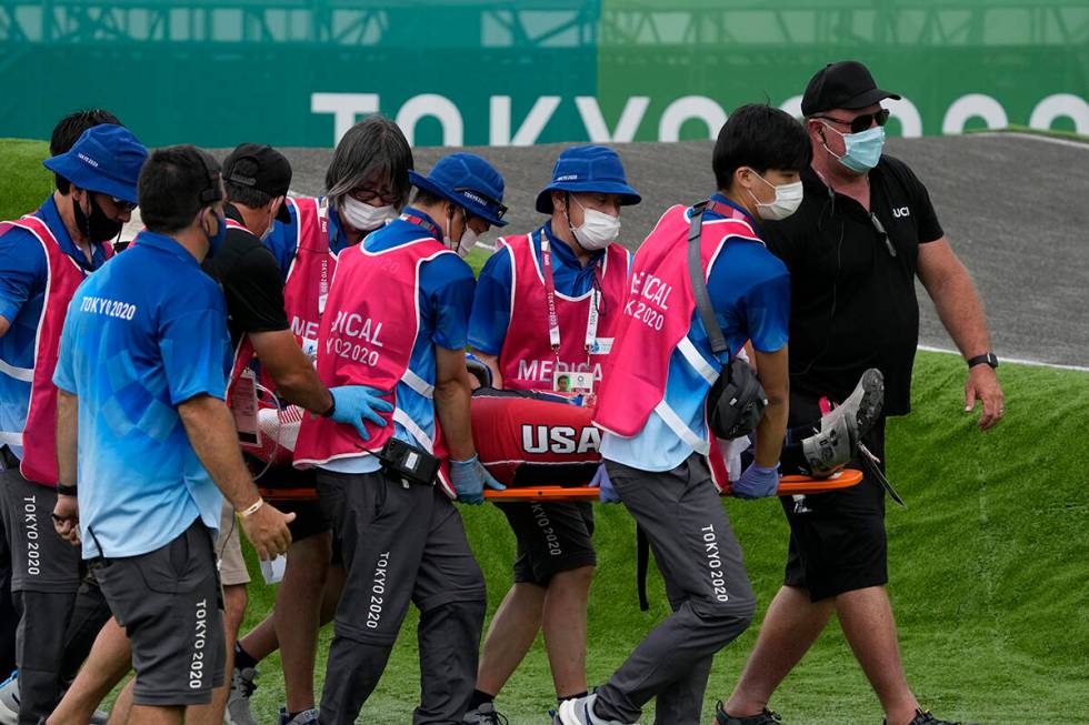 Medics carry away on a stretcher Connor Fields of the United States after he crashed at the fir ...