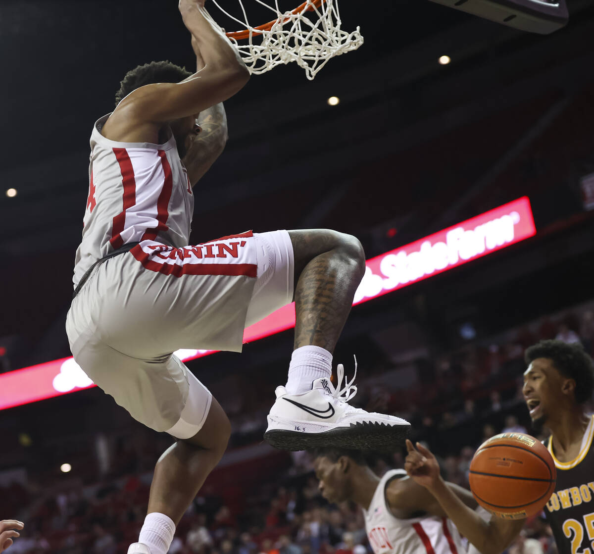 UNLV Rebels forward Royce Hamm Jr. (14) dunks the ball against the Wyoming Cowboys during the s ...