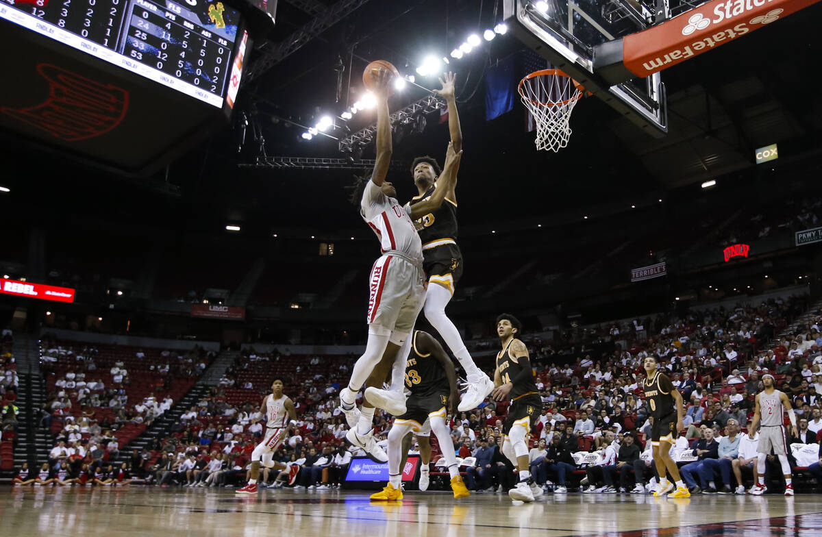 UNLV Rebels forward Donovan Williams (3) goes for a layup before getting fouled by Wyoming Cowb ...
