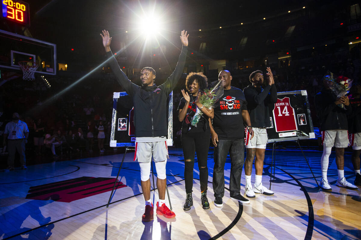 UNLV Rebels guard Bryce Hamilton, left, is honored during senior night while standing with his ...