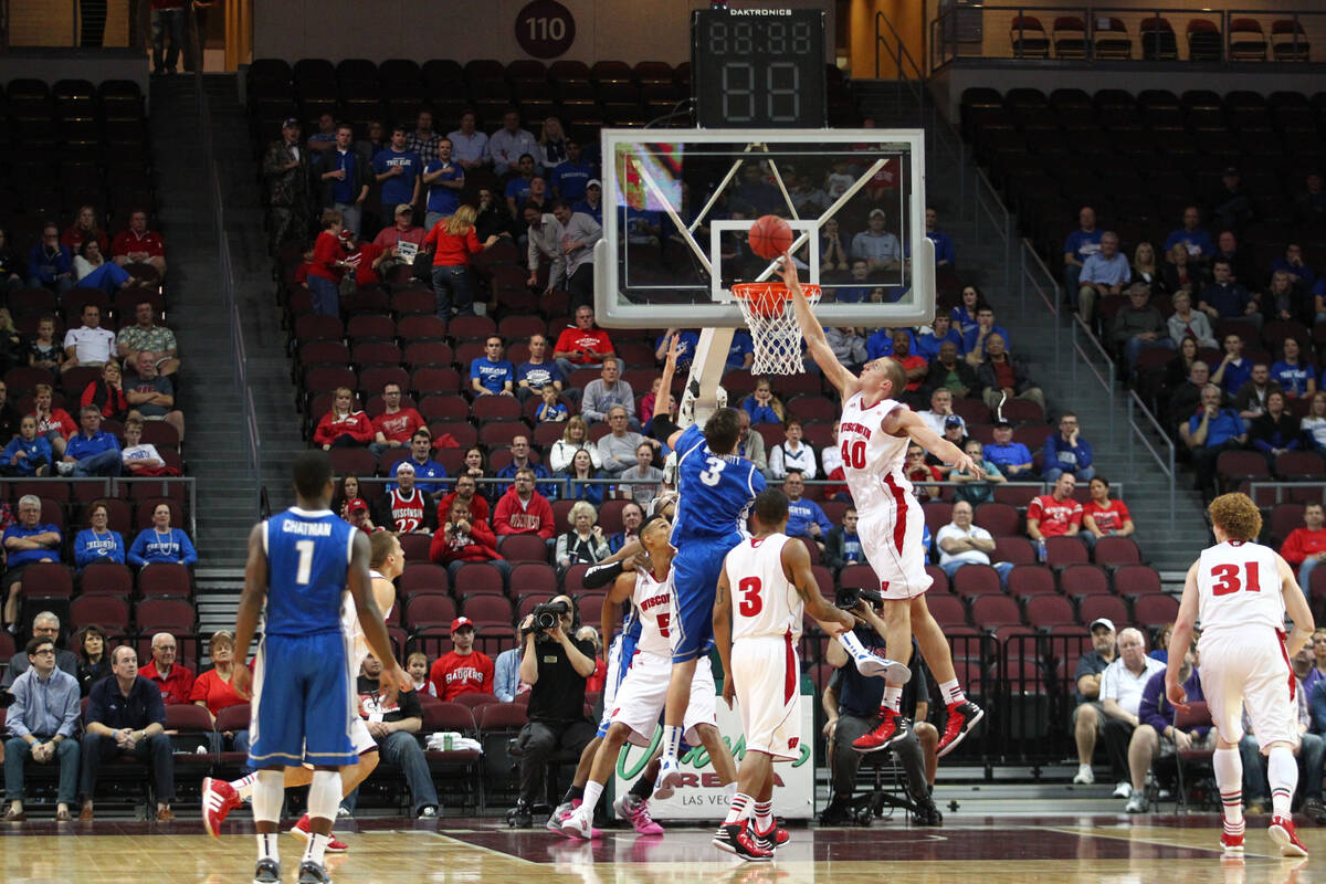 Wisconsin's Jared Berggren blocks a shot by Creighton's Doug McDermott during the 2012 Continen ...