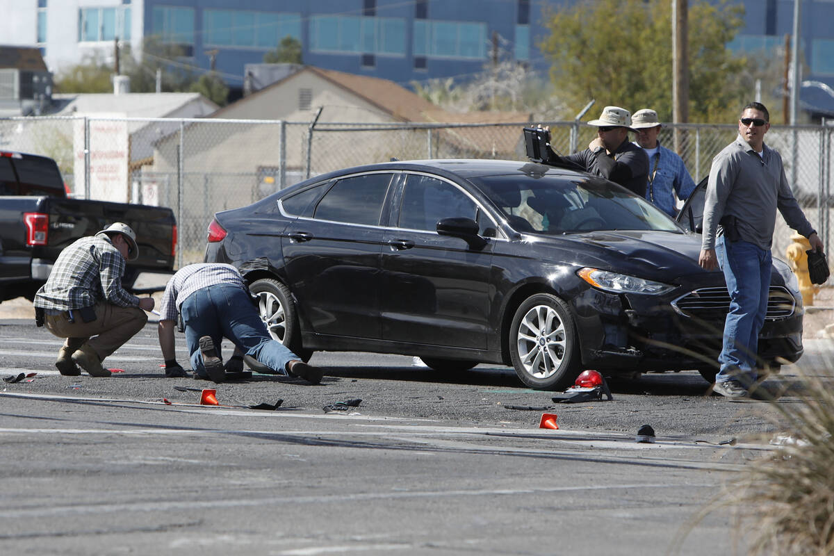 Police officers investigate a crash near Cashman Field,Thursday, March 3, 2022, in Las Vegas. ( ...