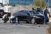 Police officers investigate a crash near Cashman Field,Thursday, March 3, 2022, in Las Vegas. ( ...