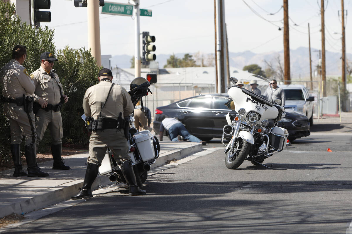 Police officers investigate a crash near Cashman Field, Thursday, March 3, 2022, in Las Vegas. ...