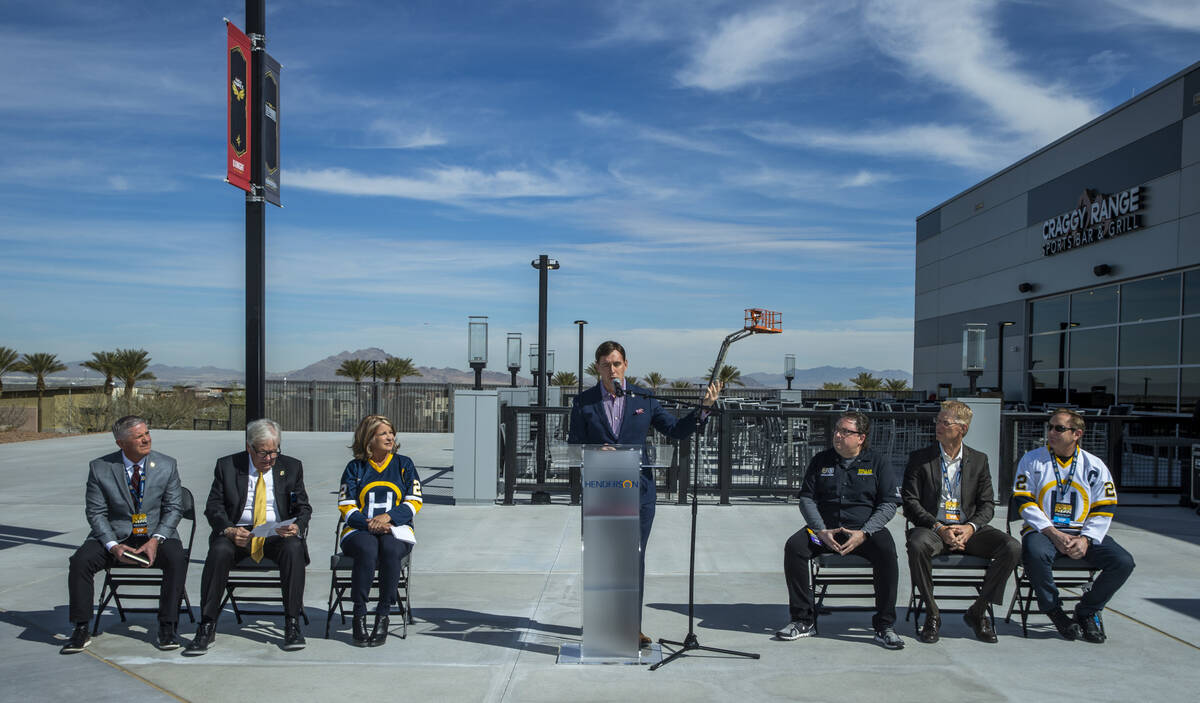 Television play-by-play voice announcer for the Golden Knights Dave Goucher, center, welcomes a ...