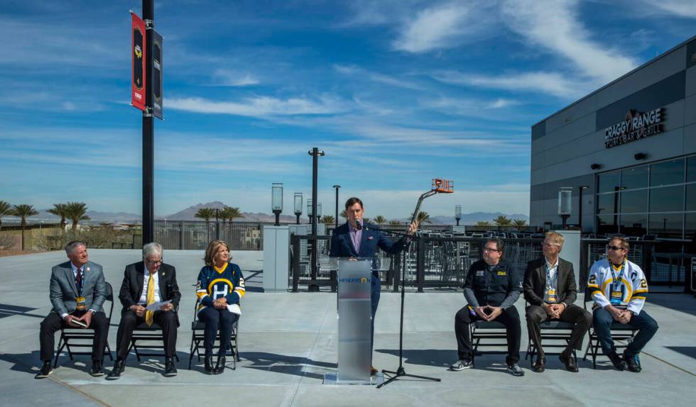 Television play-by-play voice announcer for the Golden Knights Dave Goucher, center, welcomes a ...