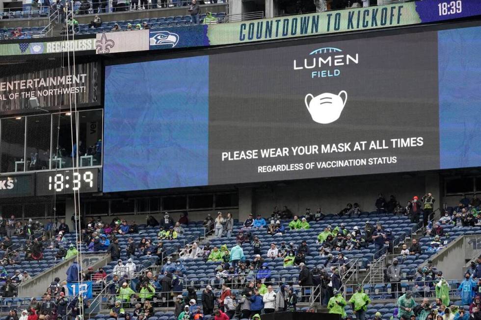A video message reminds fans to wear masks due to the COVID-19 pandemic before an NFL football ...
