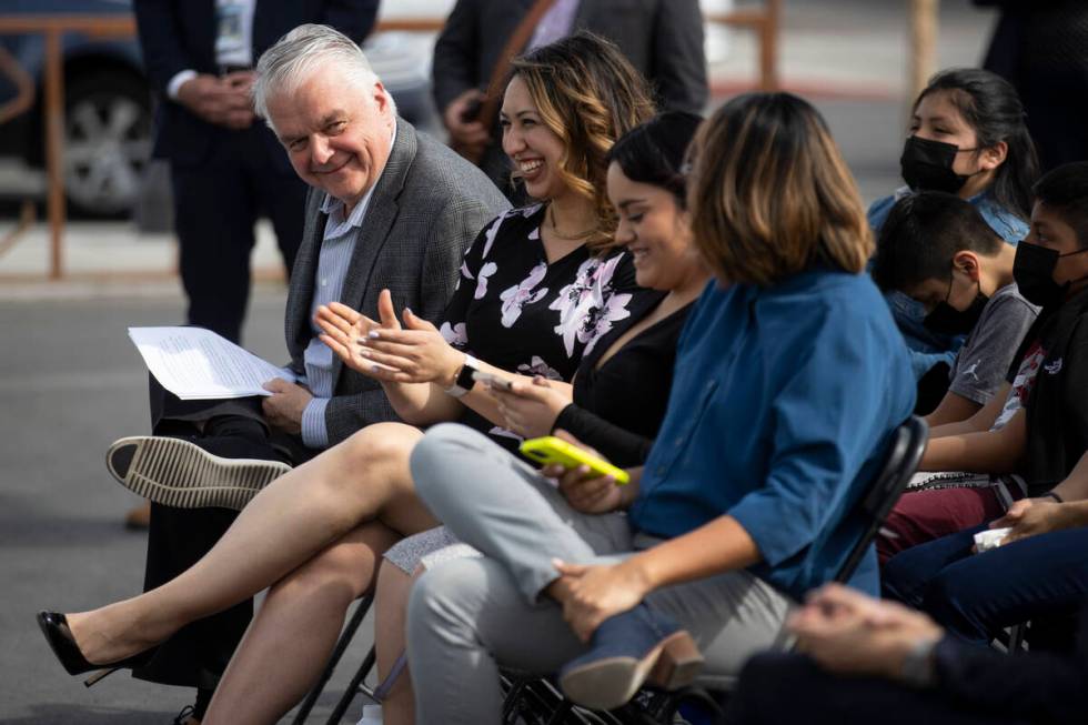 Gov. Steve Sisolak, left, participates during the grand opening ceremony for the new off-campus ...