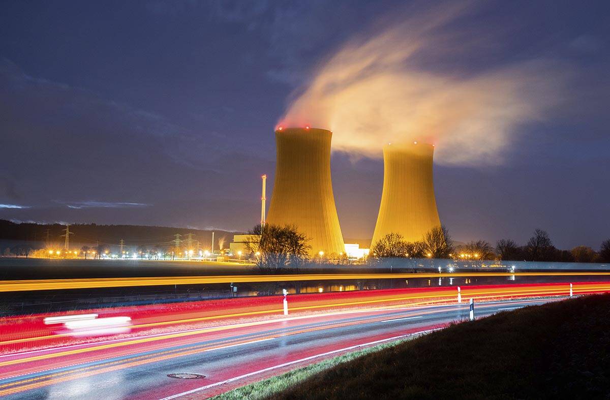 Steam rises from the cooling towers of the Grohnde nuclear power plant near Grohnde, Germany, W ...