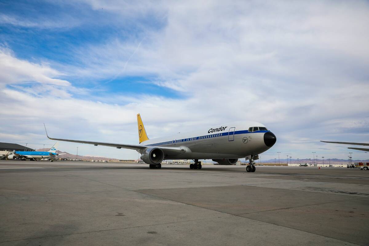 A condor plane, the first direct flight from Germany since the pandemic began, lands at Harry R ...