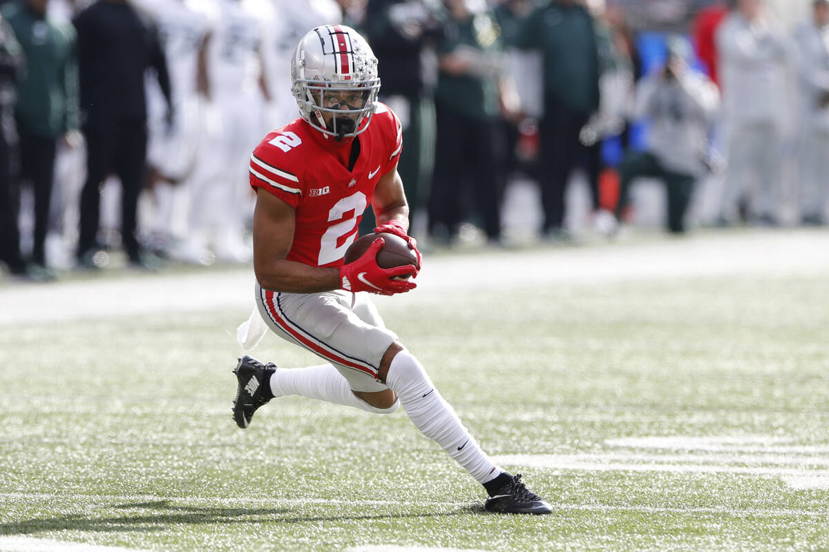 Ohio State receiver Chris Olave plays against Michigan State during an NCAA college football ga ...