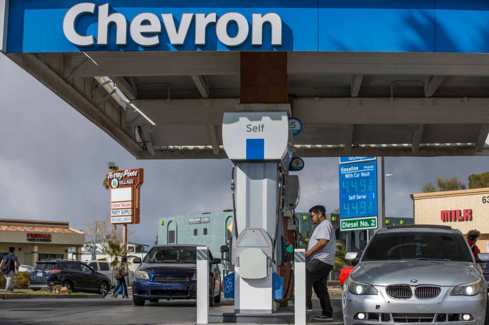 A customer pumps gas at Chevron along West Charleston Boulevard on Friday, March 4, 2022, in La ...