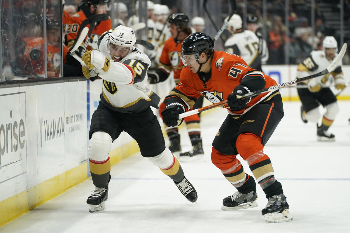 Vegas Golden Knights center Jake Leschyshyn (15) passes against Anaheim Ducks defenseman Hampus ...