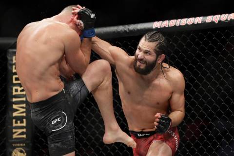 Jorge Masvidal, right, punches Nate Diaz during the second round of a welterweight mixed martia ...