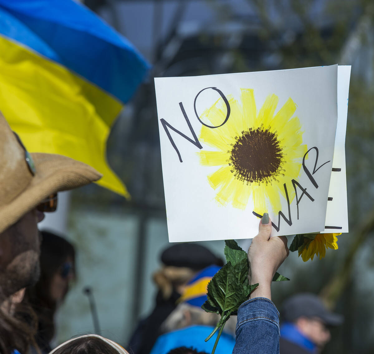 One of the many signs displayed during a Rally for Ukraine at City Hall on Saturday, March, 5, ...