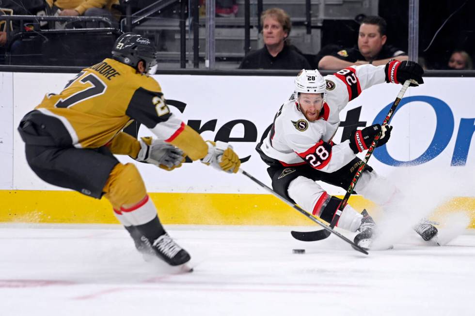 Vegas Golden Knights defenseman Shea Theodore (27) defends against Ottawa Senators right wing C ...