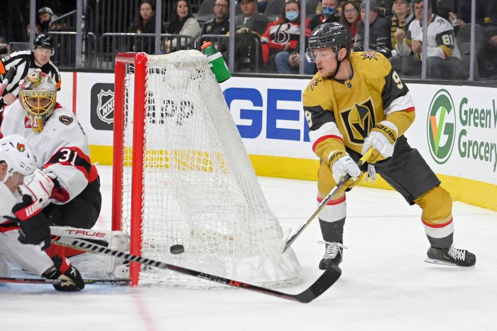 Vegas Golden Knights center Jack Eichel (9) skates around the net with the puck against the Ott ...