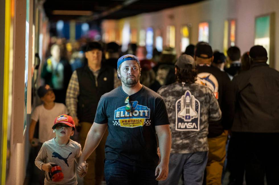 Fans make their way to the Neon Garage during the Pennzoil 400 NASCAR Cup Series race on Sunday ...