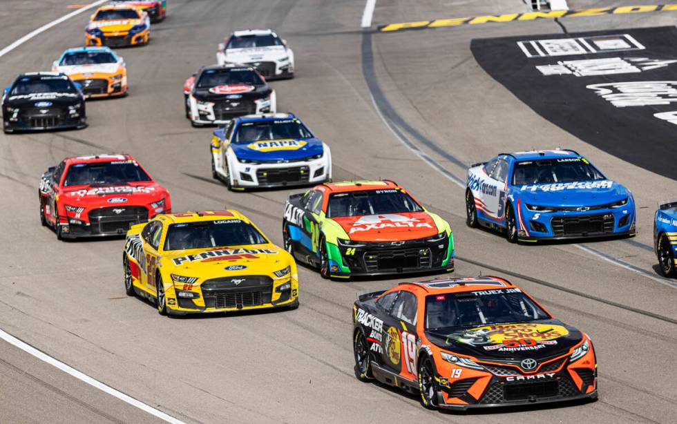 NASCAR Cup Series driver Martin Truex Jr. (19) leads the pack during the Pennzoil 400 NASCAR Cu ...