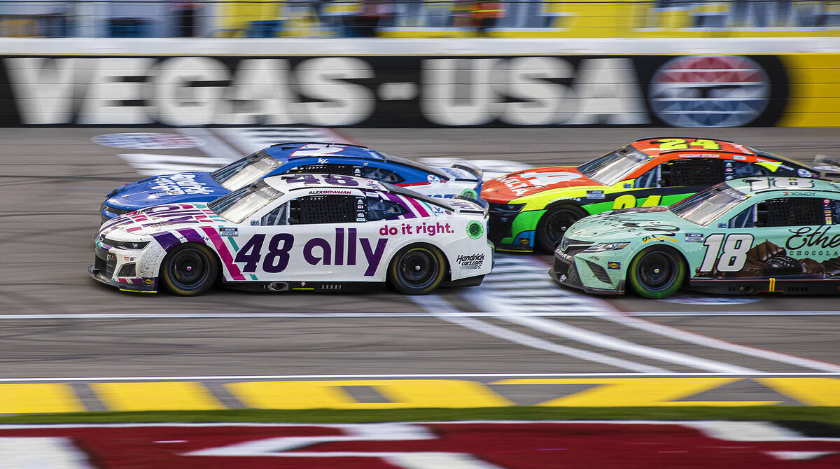 NASCAR Cup Series driver Alex Bowman (48) takes the lead in the final laps of the Pennzoil 400 ...