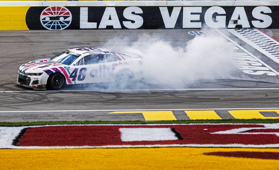 NASCAR Cup Series driver Alex Bowman (48) celebrates with a burn out after winning the Pennzoil ...