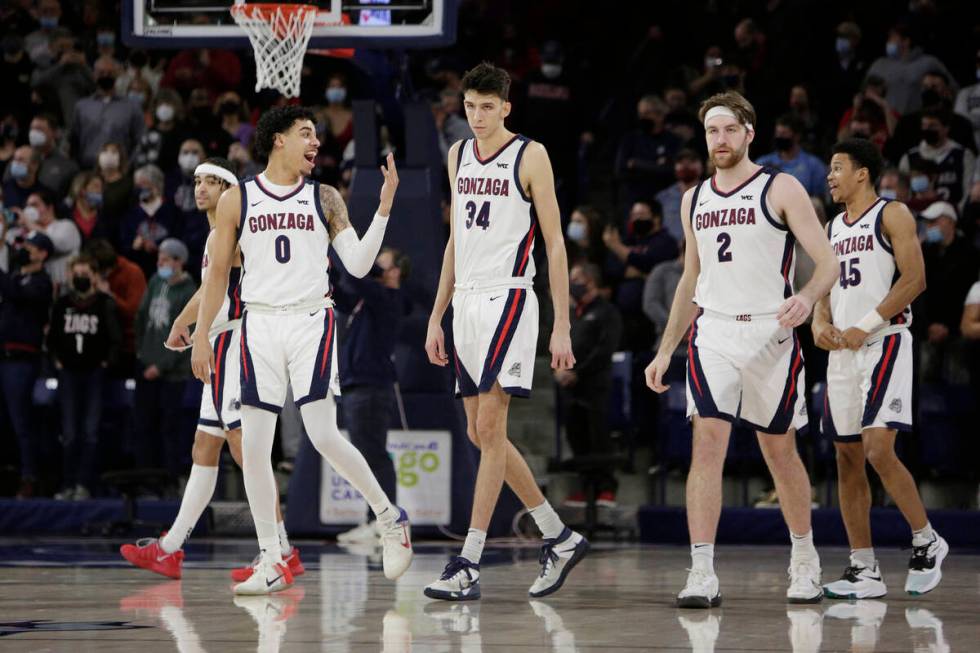 (From the left) Gonzaga guard Andrew Nembhard, guard Julian Strawther, center Chet Holmgren, fo ...