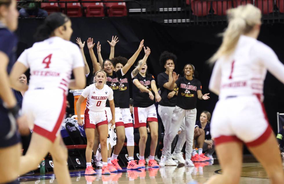 The Fresno State Bulldogs celebrate after a play during the first half of a Mountain West tourn ...