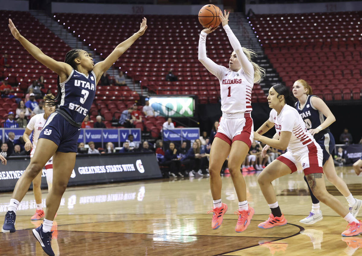 Fresno State Bulldogs guard Haley Cavinder (1) shoots against Utah State Aggies forward Laci Ha ...