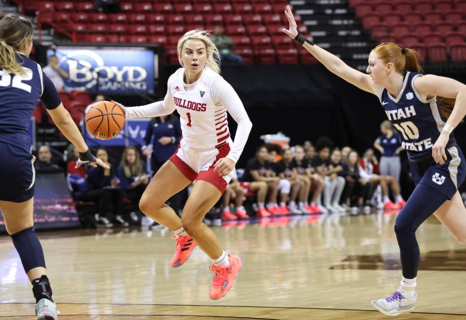 Fresno State Bulldogs guard Haley Cavinder (1) brings the ball up court against the Utah State ...