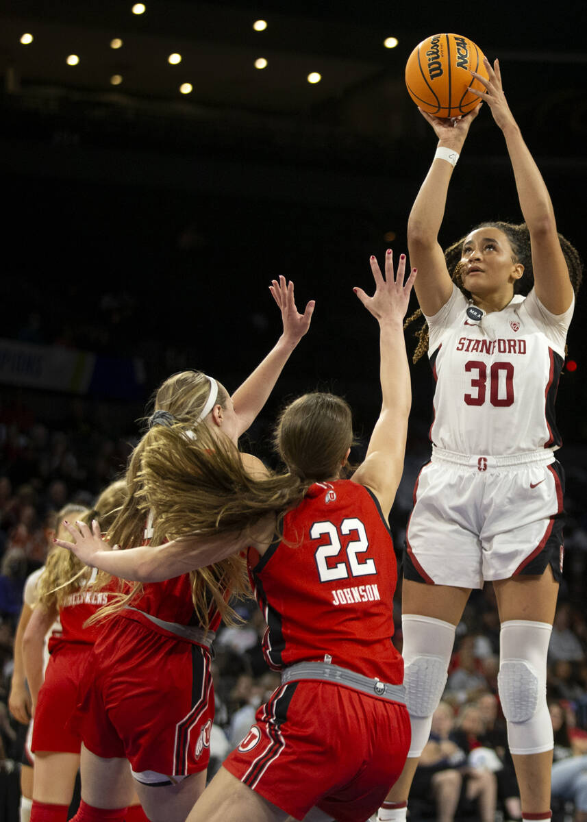 Stanford guard Haley Jones (30) shoots against Utah guard Dru Gylten, left, and forward Jenna J ...