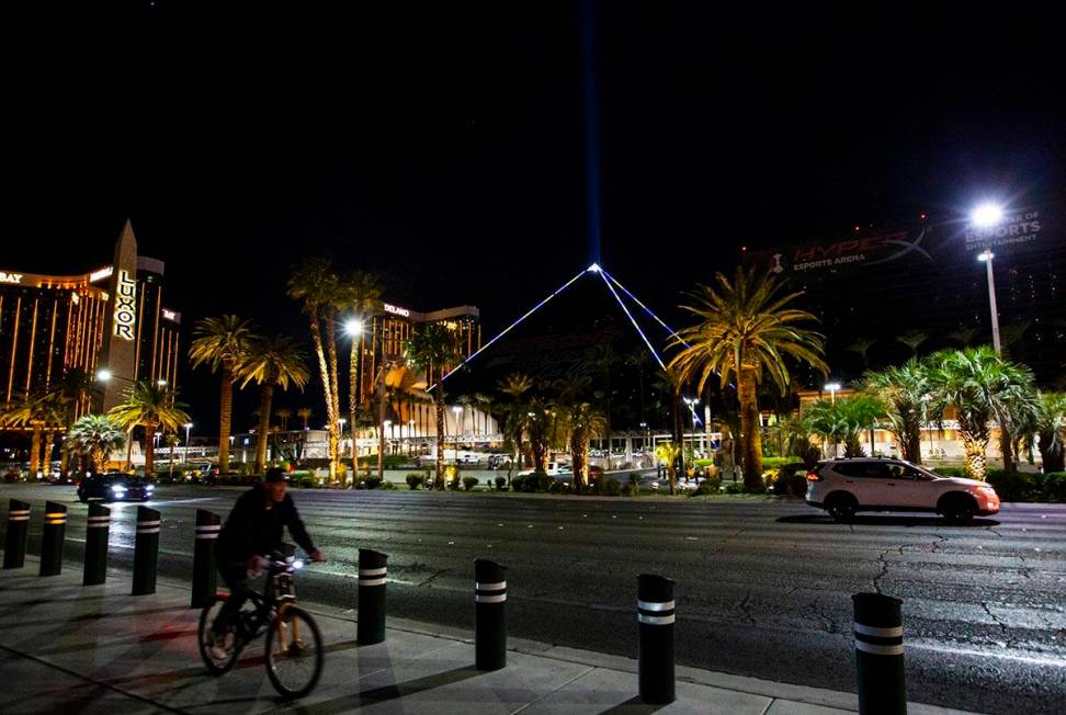 The Luxor illuminates with yellow and blue colors in support of Ukraine on Sunday, March 6, 202 ...