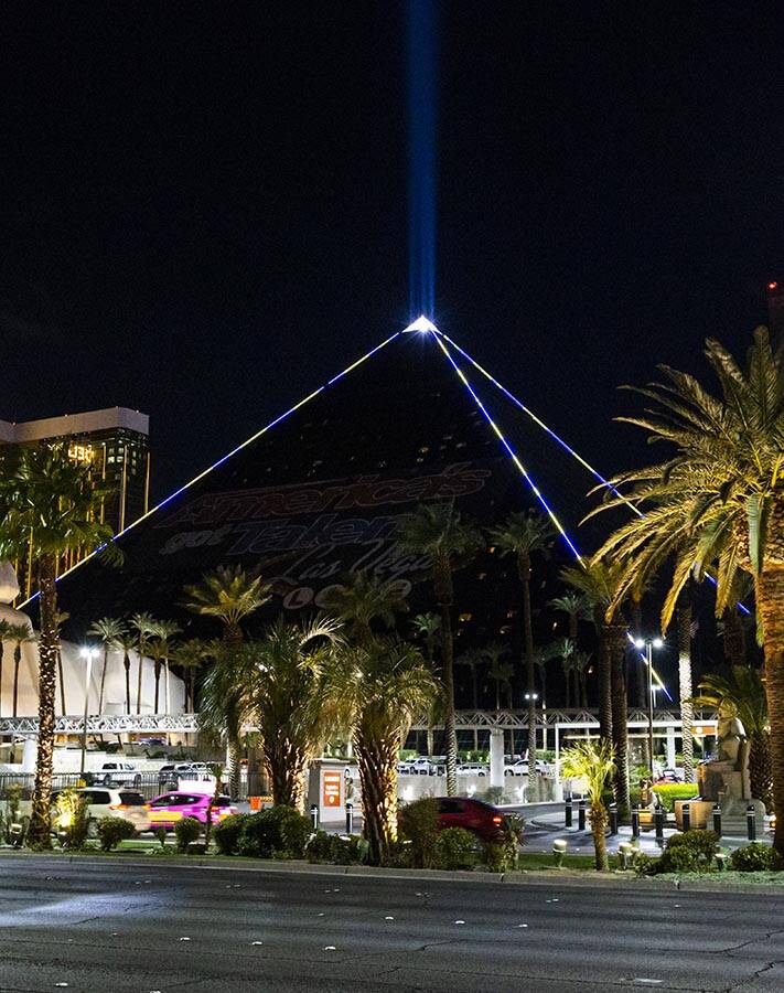 The Luxor illuminates with yellow and blue colors in support of Ukraine on Sunday, March 6, 202 ...