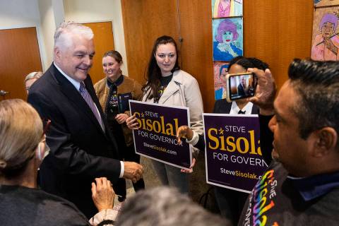 Gov. Steve Sisolak greets his supporters after formally filing for re-election, which marks the ...