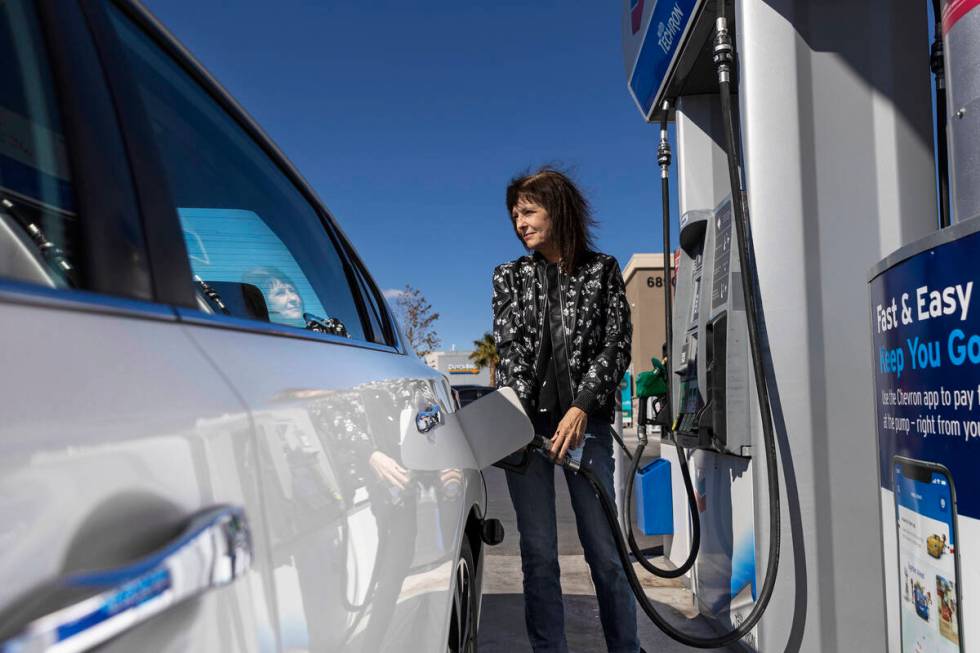 Laura Chapman fills up her car at Lucky Spot Chevron on Monday, March 7, 2022, in Las Vegas. (B ...