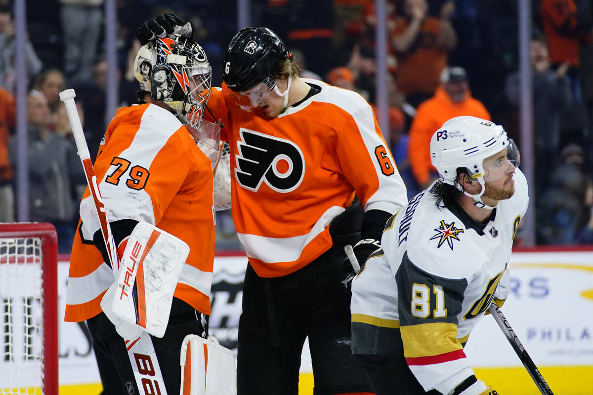 Philadelphia Flyers' Carter Hart, left, and Travis Sanheim, center, celebrate past Vegas Golden ...