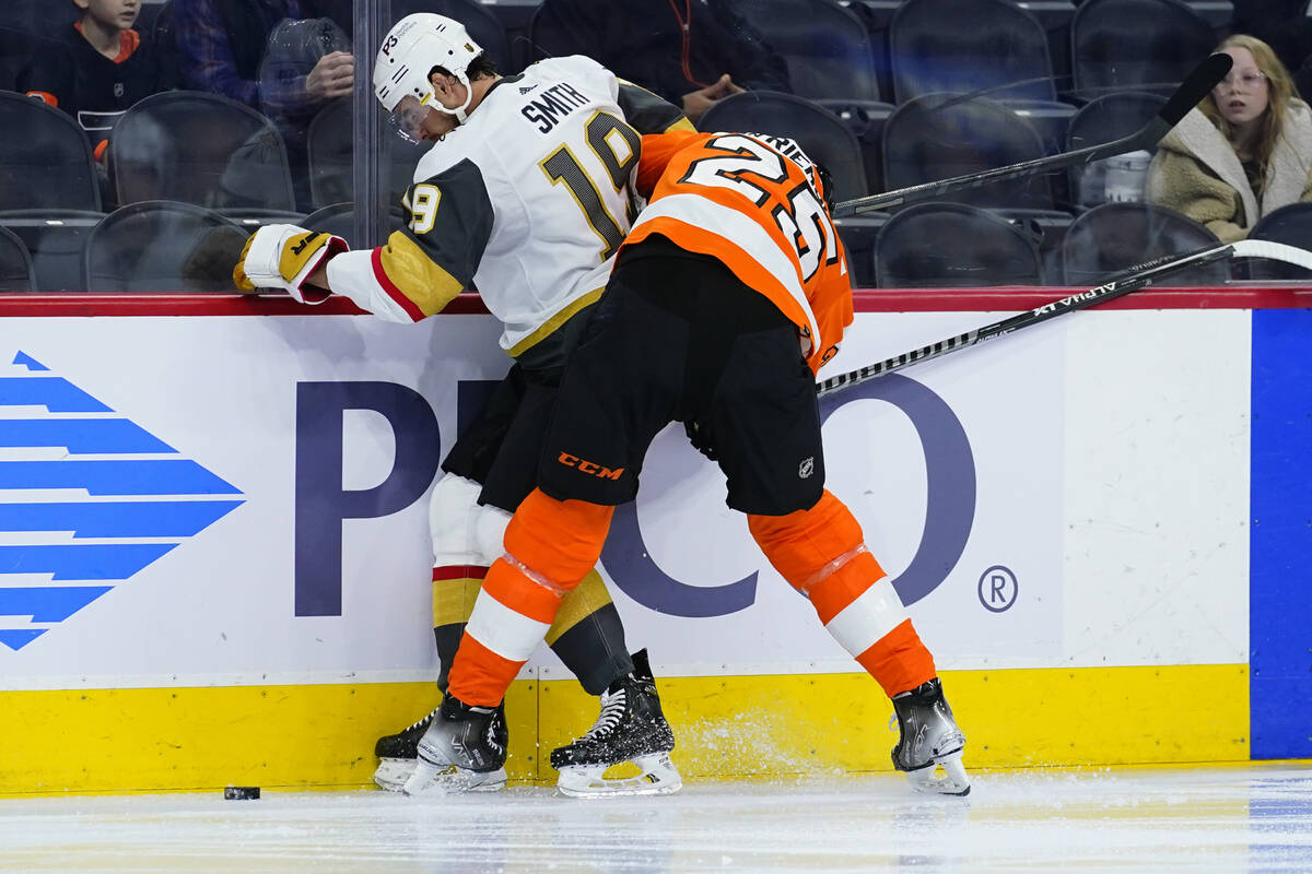 Vegas Golden Knights' Reilly Smith, left, and Philadelphia Flyers' James van Riemsdyk battle fo ...