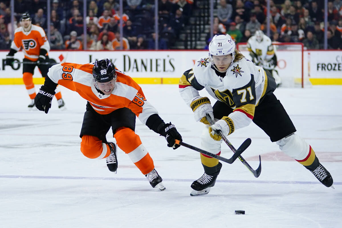 Vegas Golden Knights' William Karlsson (71) and Philadelphia Flyers' Cam Atkinson (89) chase af ...