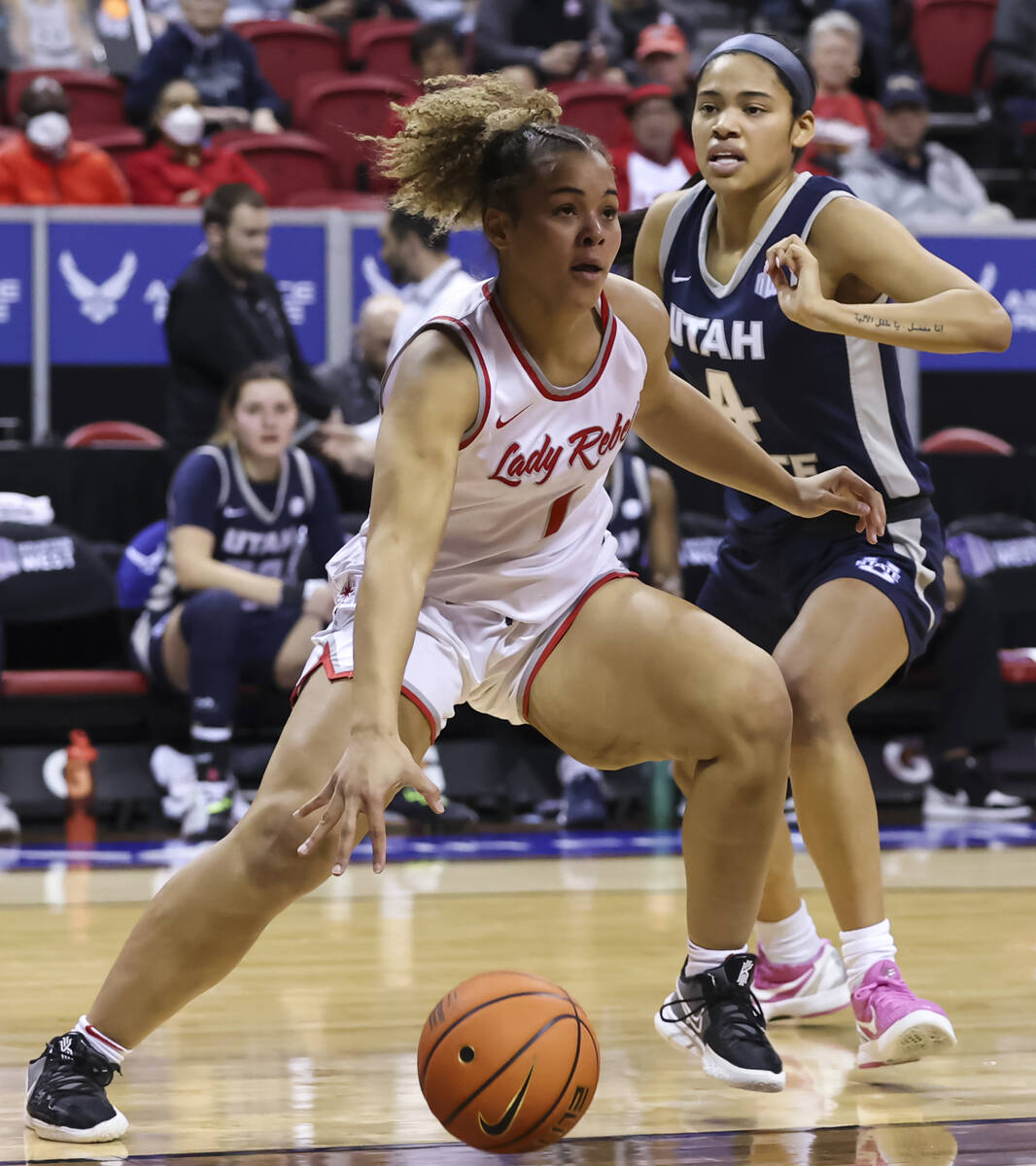 UNLV Lady Rebels forward Nneka Obiazor (1) drives to the basket against Utah State Aggies guard ...