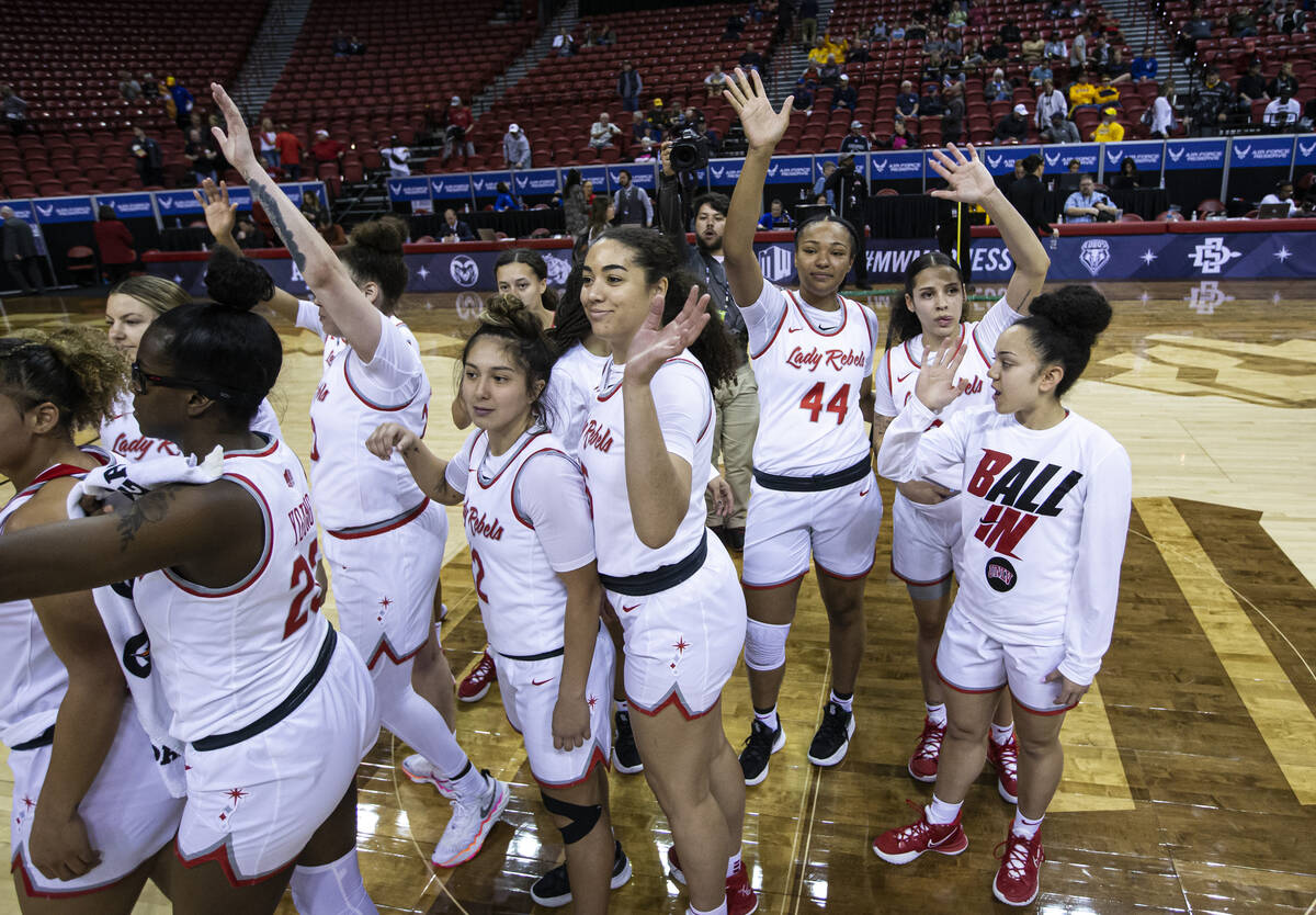 The UNLV Lady Rebels acknowledge the crowd after defeating the Utah State Aggies in the quarter ...