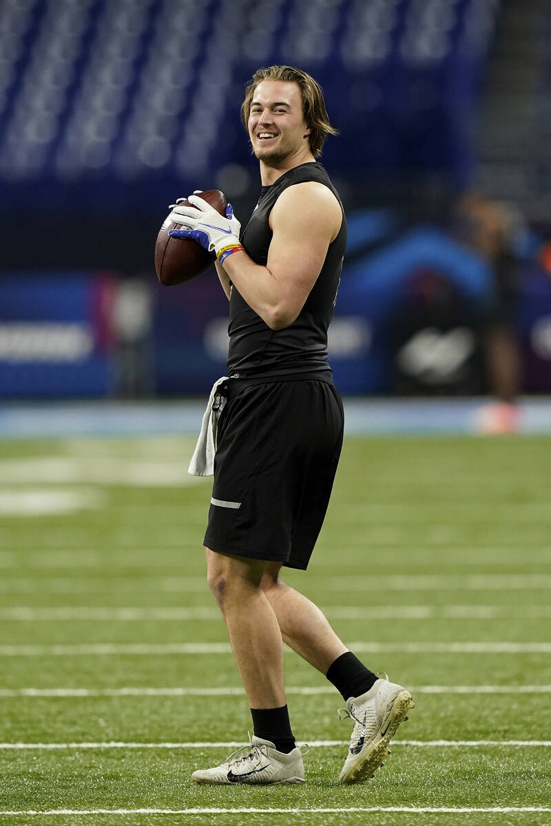 Pittsburgh quarterback Kenny Pickett (11) warms up at the NFL football scouting combine in Indi ...