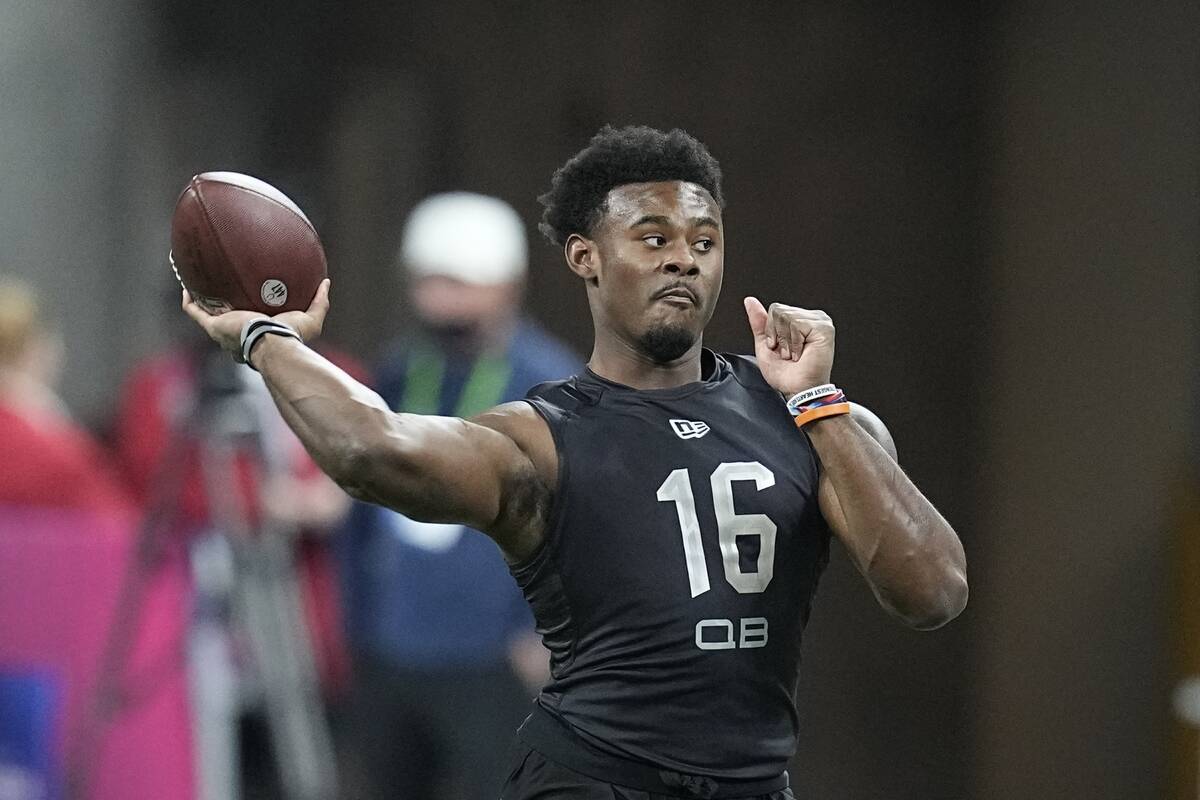 Liberty quarterback Malik Willis runs a drill during the NFL football scouting combine, Thursda ...