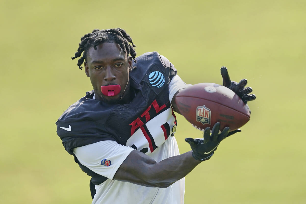 FILE - Atlanta Falcons wide receiver Calvin Ridley (18) makes a catch during the team's NFL tra ...