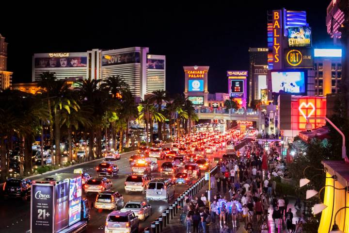 The Strip is packed outside Paris Las Vegas on Friday, March 19, 2021, in Las Vegas. (Benjami ...