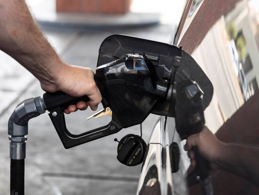 David Newman of Las Vegas pumps gas at Terrible’s on Torrey Pines Drive on Monday, March ...