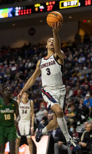 Gonzaga Bulldogs guard Andrew Nembhard (3) slashes to the rim past San Francisco Dons forward J ...