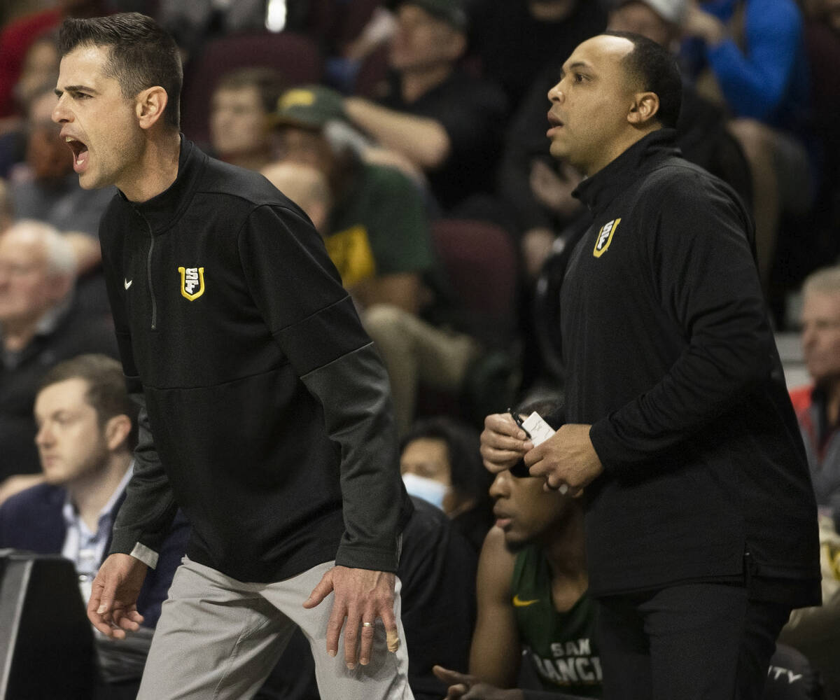 San Francisco Dons head coach Todd Golden, left, coaches his team in the first half of the West ...