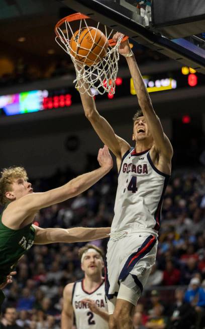 Gonzaga Bulldogs center Chet Holmgren (34) dunks on San Francisco Dons forward Zane Meeks (5) i ...