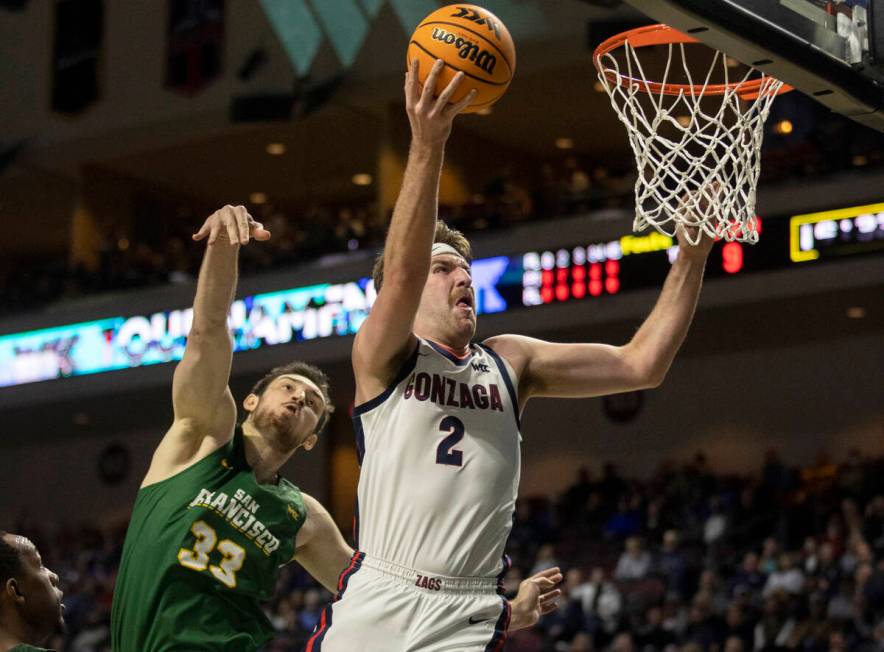 Gonzaga Bulldogs forward Drew Timme (2) slashes to the rim past San Francisco Dons center Volod ...